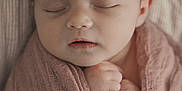 Kennedy joined the competition — help win amazing prizes! adorable, baby, bow, child, closeup, cozy, cute, face, hands, headband, indoors, infant, newborn, peaceful, pink_blanket, portrait, resting, sleeping, soft_texture, wrapped