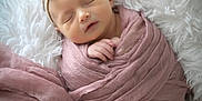 Kennedy is registered to the contest to win money with this photo: newborn, baby, sleeping, swaddle, headband, bow, blanket, soft, cute, infant, portrait, closeup, peaceful, pink, white, fluffy, cozy, resting, child, wrapped