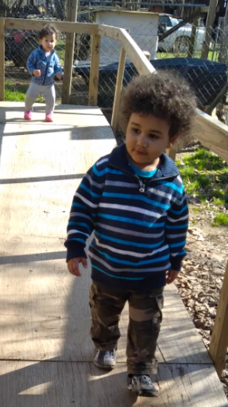 Kylan joined the competition — help win amazing prizes! child, concrete, cool, denim, fun, happy, leg, leisure, pattern, person, plant, recreation, sidewalk, sitting, sleeve, street_fashion, t_shirt, toddler, tree, vacation