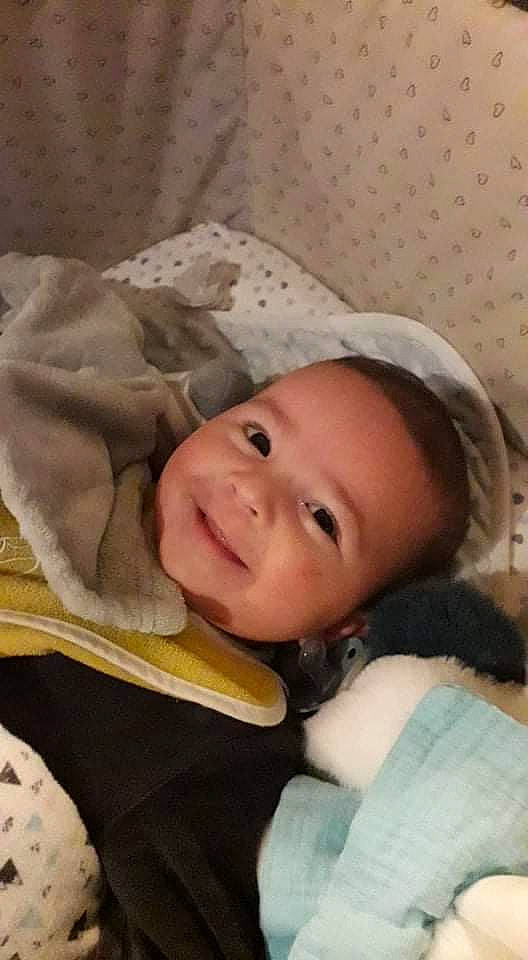 Ethan participe au concours pour gagner de l'argent avec cette photo : baby, baby_products, baby_toddler_clothing, cap, cheek, child, chin, comfort, eyebrow, face, fashion_accessory, fur, happy, iris, joy, linens, lip, nose, person, skin