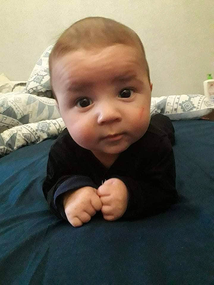 Ethan participe au concours pour gagner de l'argent avec cette photo : baby, baby_toddler_clothing, cheek, child, comfort, elbow, eye, flooring, gesture, happy, hardwood, linens, nose, person, sitting, skin, sleeve, smile, thumb, toddler