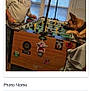 activity, blinds, brown_dog, casual, competition, dog, focus, foosball_table, fun, game, indoor, light, man, person, pet, playing, room, stickers, table, window