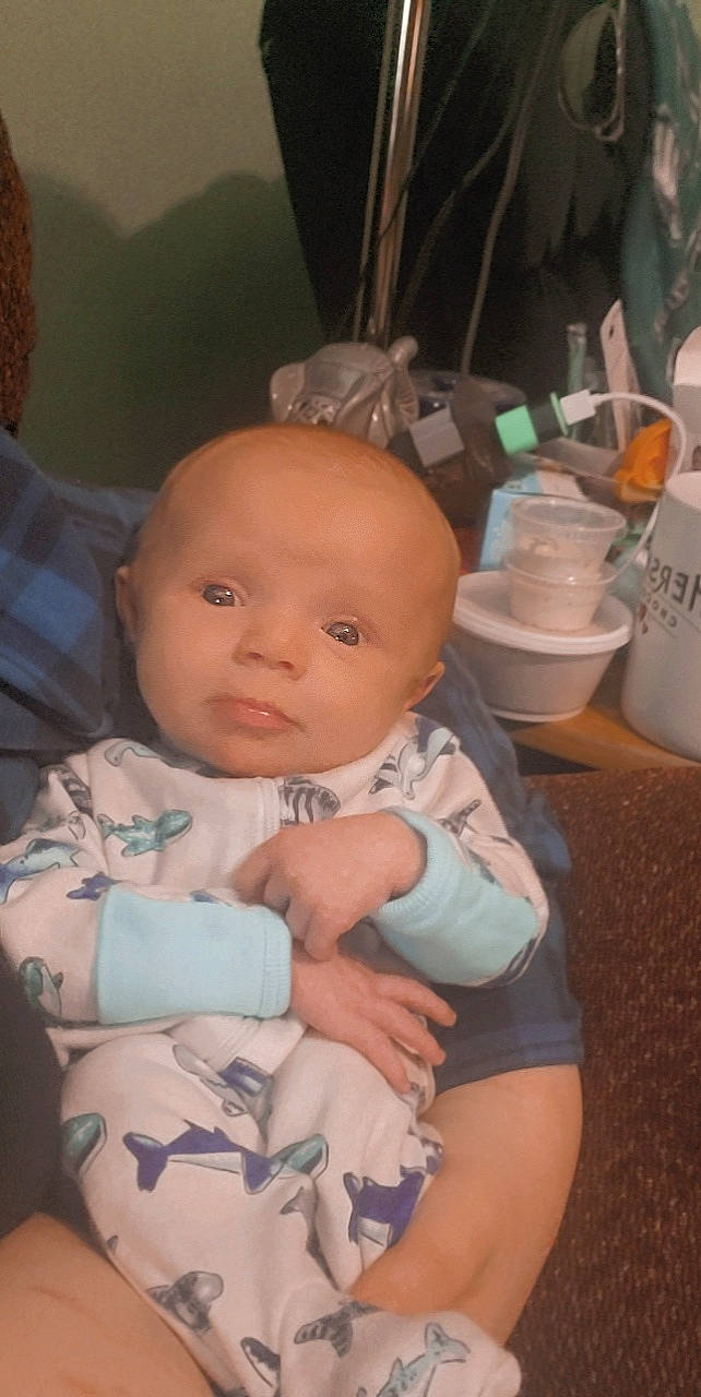 Jasper is registered to the contest to win money with this photo: abdomen, baby, baby_products, baby_toddler_clothing, cheek, child, chin, comfort, eyebrow, happy, iris, mouth, nail, nose, person, sitting, skin, smile, thumb, toddler