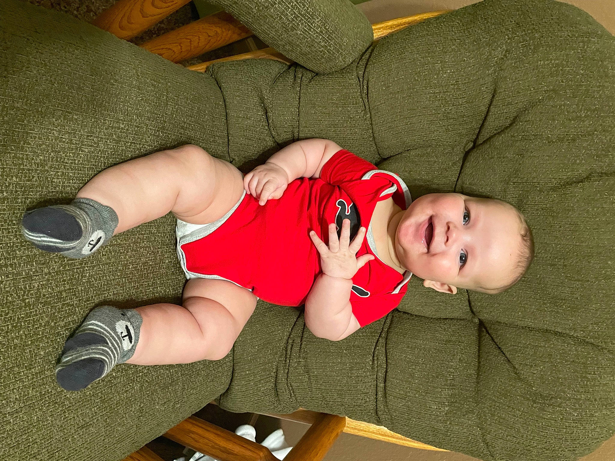 Langston joined the competition — help win amazing prizes! arm, baby, baby_toddler_clothing, child, comfort, elbow, finger, foot, hat, headgear, human_leg, joy, knee, lap, leg, person, sleeve, sock, sports_uniform, sportswear
