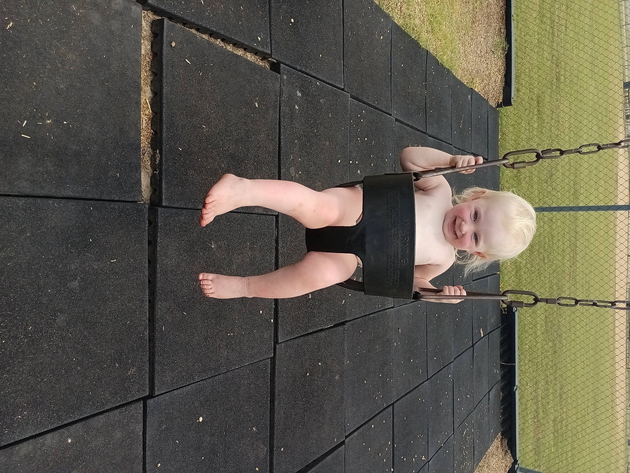 Graclyn is registered to the contest to win money with this photo: arm, asphalt, child, concrete, floor, flooring, fun, hand, human_body, human_leg, joy, leg, mesh, pattern, person, road_surface, sandal, shadow, sidewalk, thigh