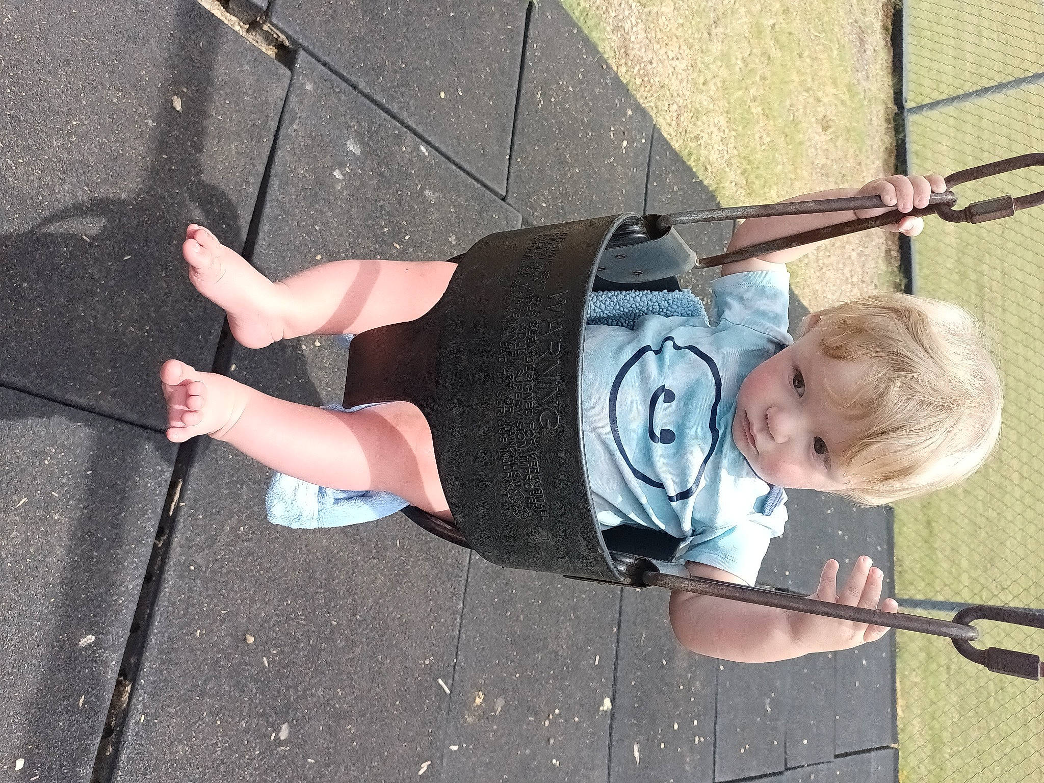 Hunter joined the competition — help win amazing prizes! asphalt, baby, calf, elbow, foot, fun, human_leg, knee, person, recreation, road_surface, sandal, shoe, sneakers, sock, t_shirt, thigh, toddler, tree, waist