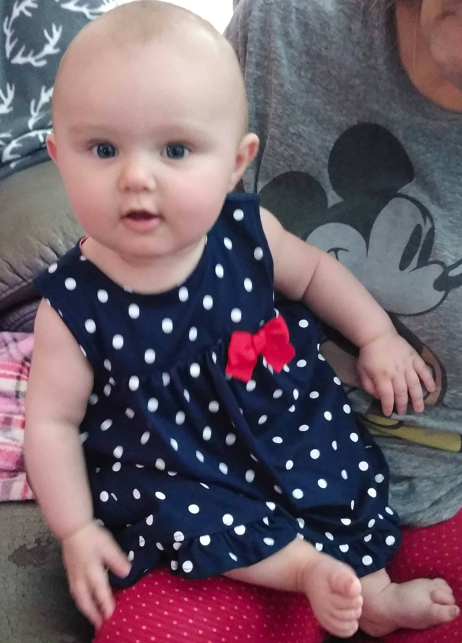 Charity is registered to the contest to win money with this photo: baby, baby_products, baby_toddler_clothing, cheek, child, design, dress, face, head, lip, pattern, person, pink, polka_dot, sitting, skin, sleeve, toddler