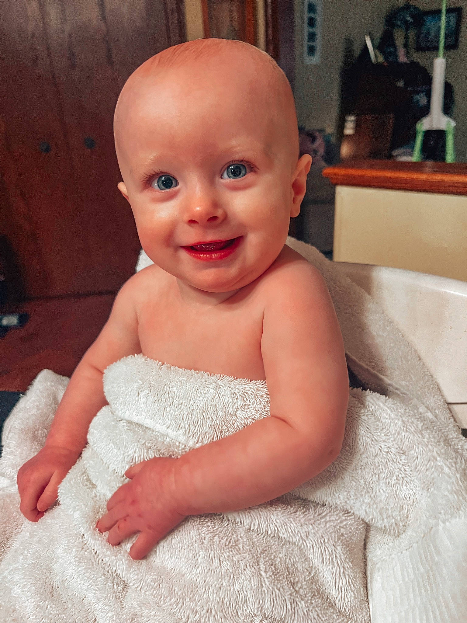 Evelynn is registered to the contest to win money with this photo: baby, baby_toddler_clothing, cheek, child, chin, comfort, dress, embellishment, eyebrow, eyelash, face, finger, flooring, happy, iris, joy, lip, neck, person, skin