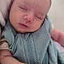 baby, sleeping, infant, soft_blanket, close_up, peaceful, hand, face, newborn, texture, resting, serene, cute, portrait, child, wrapped, cozy, delicate, skin, zipped_blanket