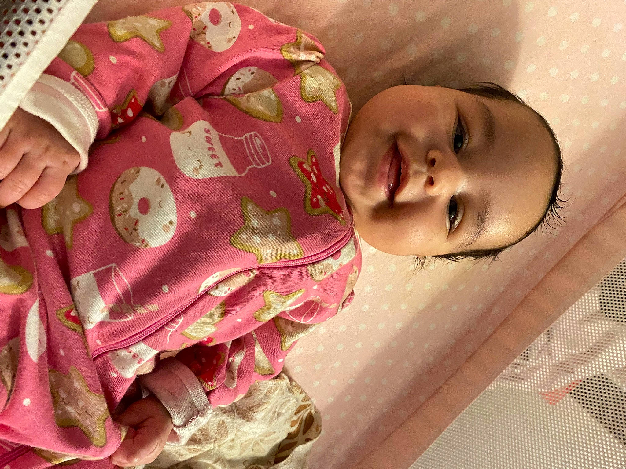 Kamille is registered to the contest to win money with this photo: baby, beauty, carmine, cheek, child, eyelash, fashion_accessory, happy, linens, lip, magenta, mouth, pattern, person, pink, room, skin, sleeve, smile, textile