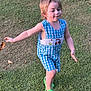 child, toddler, grass, outdoor, green_shoes, blue_romper, running, happy, smiling, sunlight, nature, playful, cute, daylight, grass_field, person, young_child, summer, bare_arms, casual_clothing