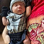 Juan joined the competition — help win amazing prizes! baby, newborn, sleeping, infant, clothing, mittens, hat, person, holding, tshirt, fabric, pattern, closeup, soft_focus, indoor, cute, peaceful, resting, portrait, hand