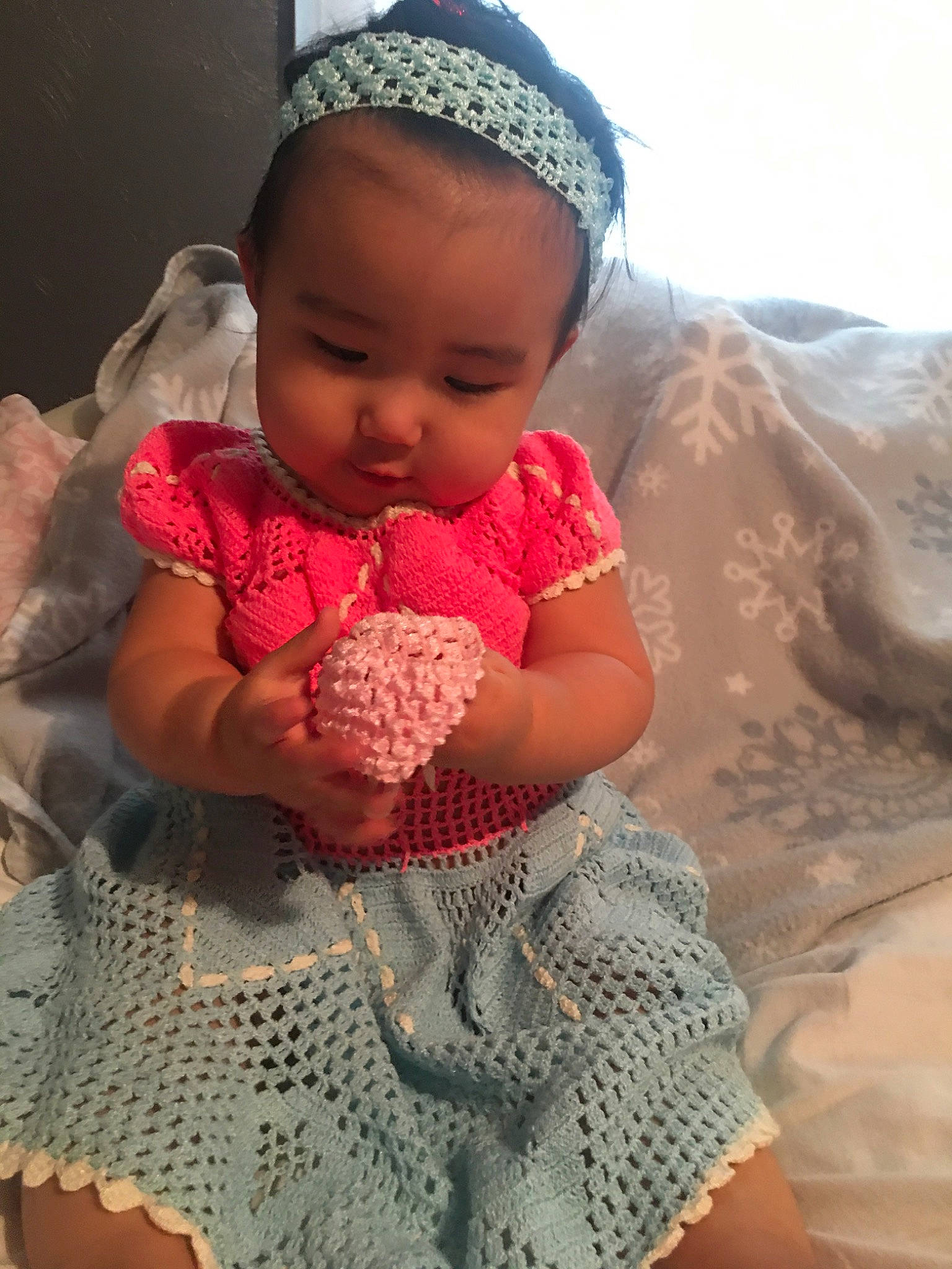 Celeste is registered to the contest to win money with this photo: baby, baby_products, baby_toddler_clothing, bonnet, child, costume_accessory, craft, creative_arts, crochet, hair_accessory, headgear, headpiece, knitting, pattern, person, pink, product, skin, textile, toddler
