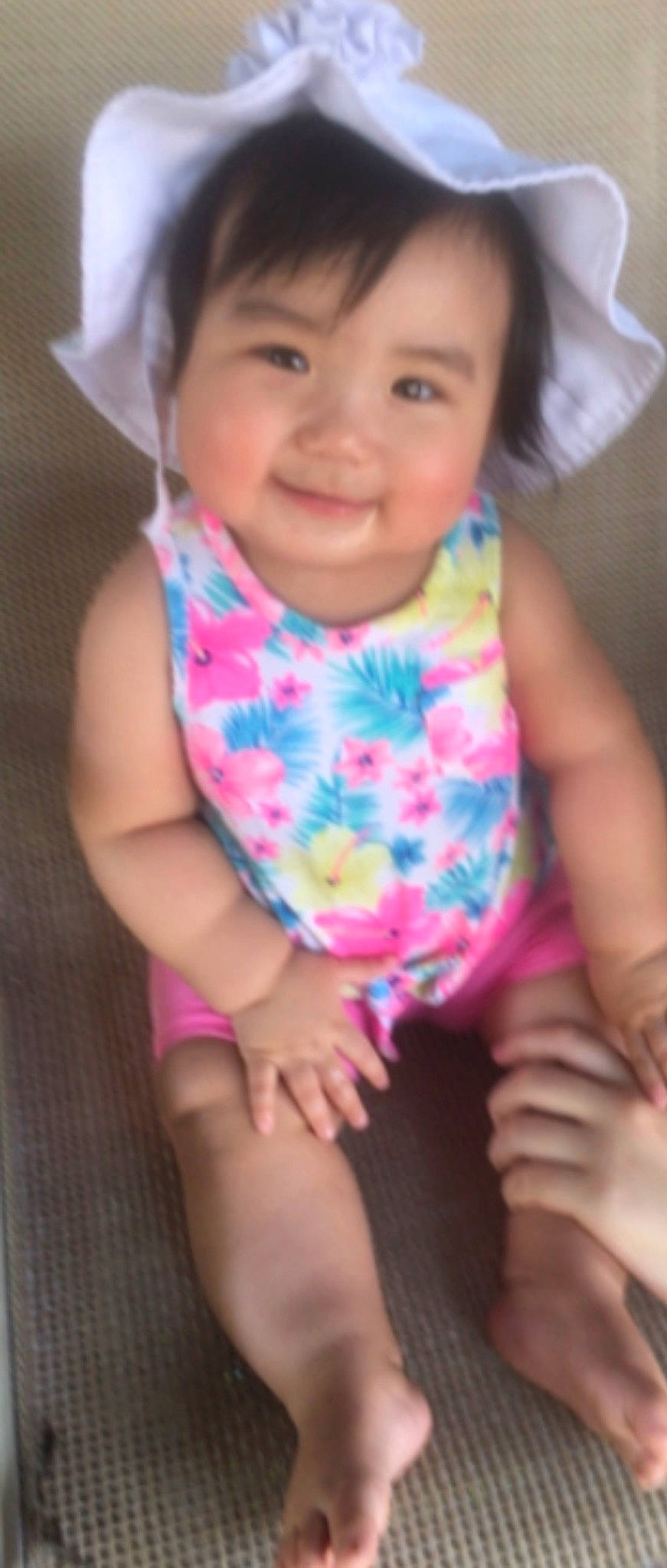 Celeste is registered to the contest to win money with this photo: active_tank, baby, baby_products, baby_toddler_clothing, cheek, child, finger, hand, joy, mouth, nail, nightwear, nose, person, pink, skin, sleeveless_shirt, sun_hat, thigh, thumb