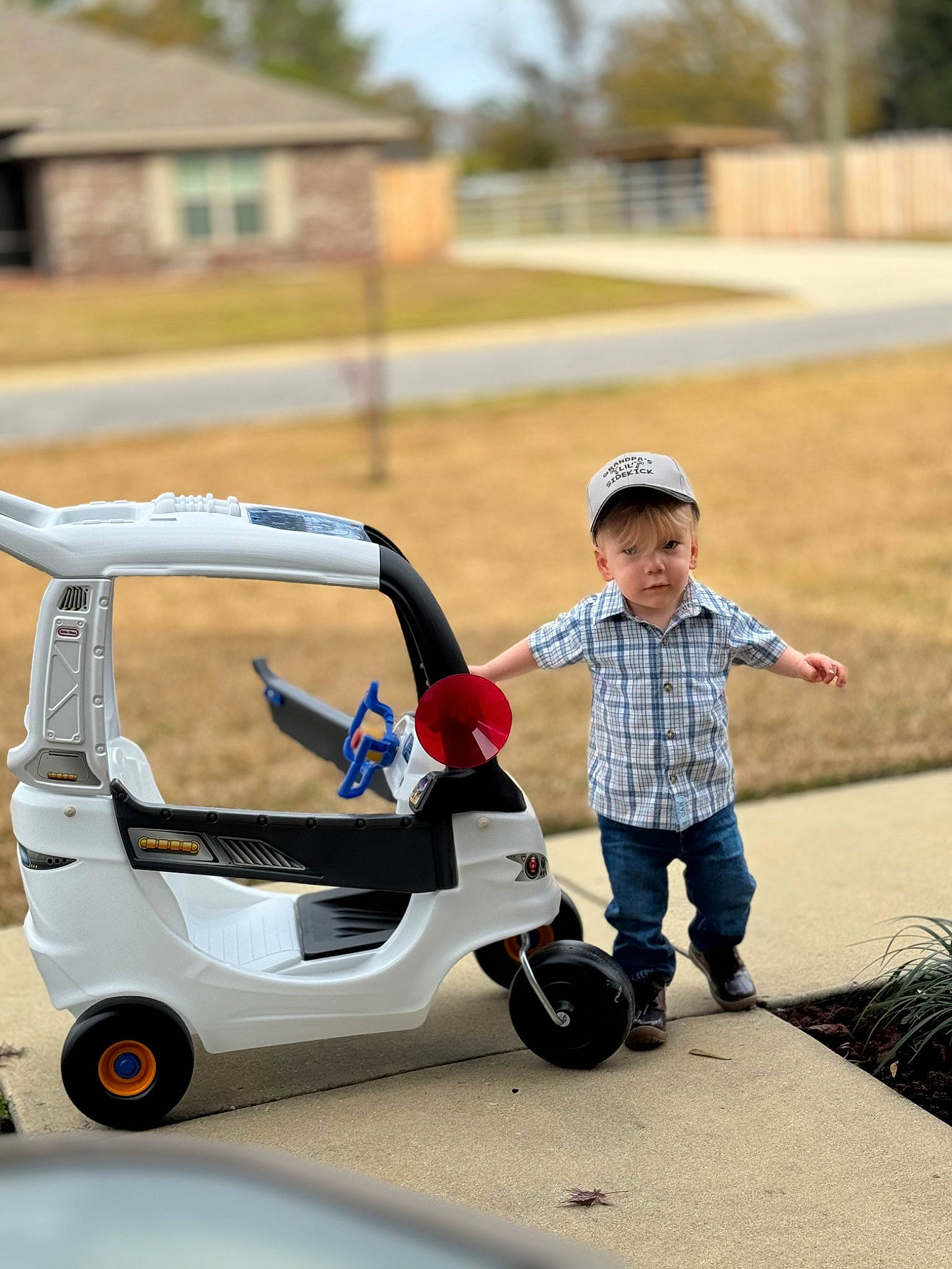William joined the competition — help win amazing prizes! asphalt, auto_part, automotive_design, automotive_exterior, automotive_tire, automotive_wheel_system, baby, car, fun, grass, leisure, motor_vehicle, person, play, recreation, rolling, tire, toddler, tree, vehicle