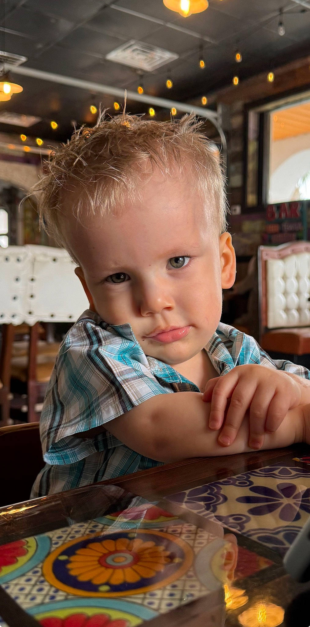 William joined the competition — help win amazing prizes! chair, cheek, child, chin, facial_expression, flooring, fun, happy, leisure, pattern, person, play, recreation, room, sitting, t_shirt, table, tableware, toddler, vacation