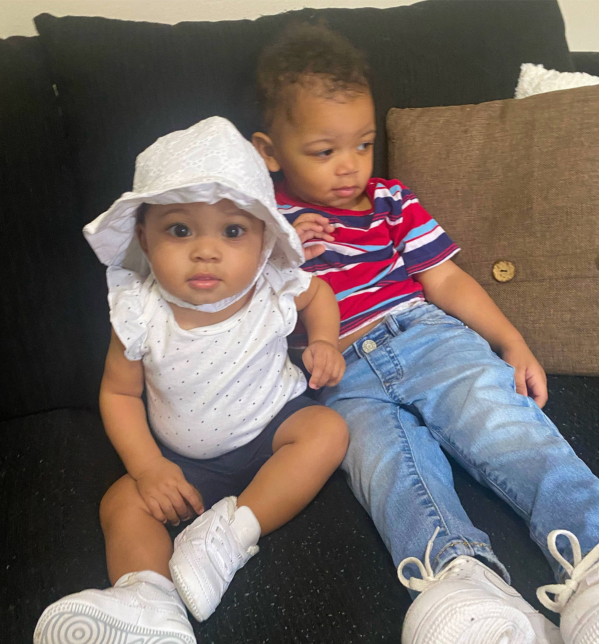 Amira joined the competition — help win amazing prizes! baby_toddler_clothing, cheek, child, comfort, cool, denim, ear, eye, headwear, human, jeans, mouth, nose, person, shipping_box, sitting, skin, sock, sun_hat, t_shirt