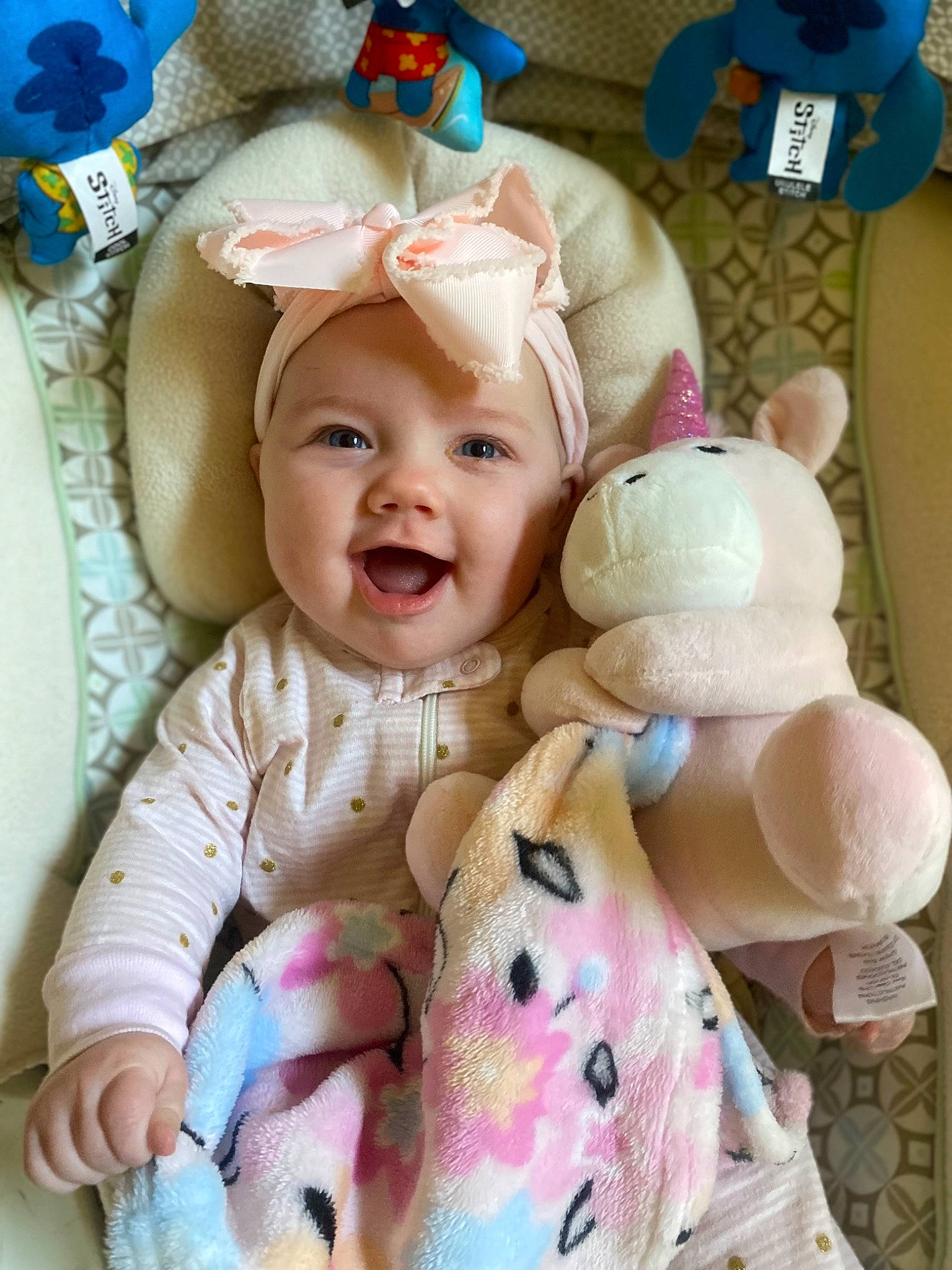 Lacey joined the competition — help win amazing prizes! baby, baby_products, baby_toddler_clothing, blue, cheek, child, happy, headwear, linens, pattern, person, pink, product, room, skin, sleeve, smile, stuffed_toy, textile, toddler