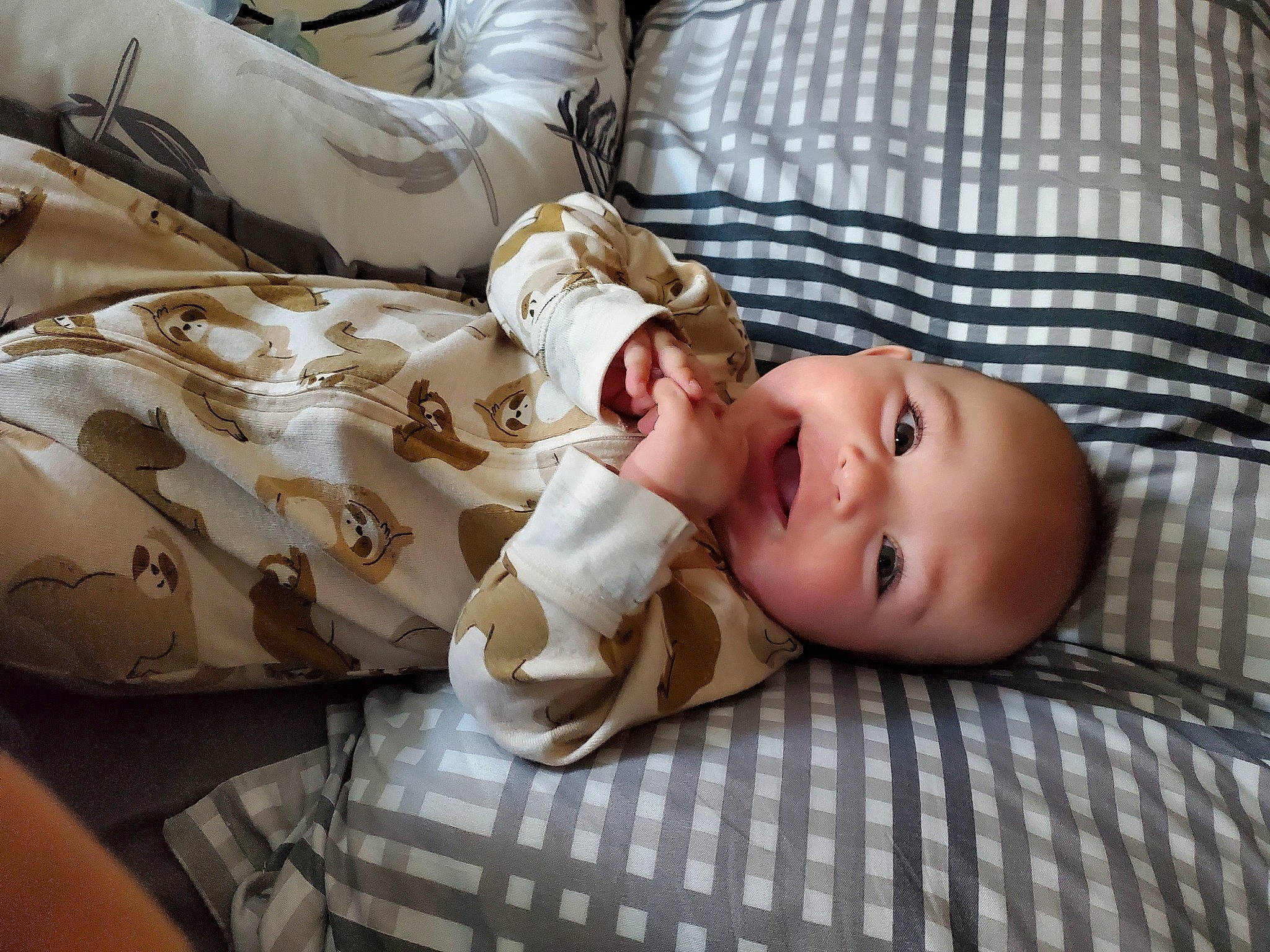 Archer joined the competition — help win amazing prizes! baby, baby_products, baby_toddler_clothing, bedding, child, comfort, hat, linens, mammal, pattern, person, plaid, room, sitting, skin, sleep, sleeve, smile, toddler, vertebrate