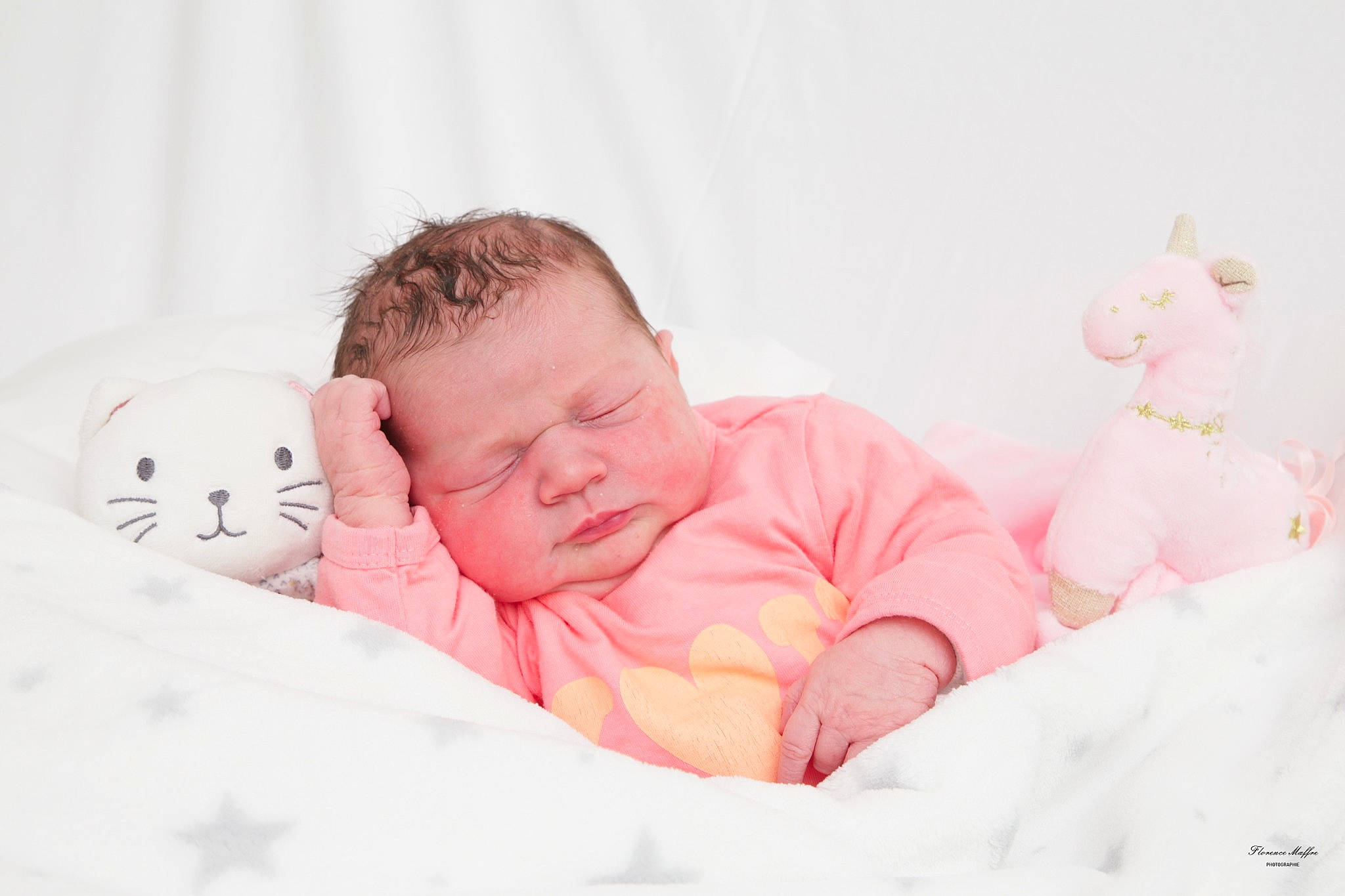 Célestine a rejoint le concours — aidez-le/la à gagner de superbes lots ! baby, baby_products, baby_sleeping, baby_toddler_clothing, bed, bedding, bedtime, cheek, child, comfort, happy, linens, mammal, person, pink, product, sitting, skin, toddler, toy
