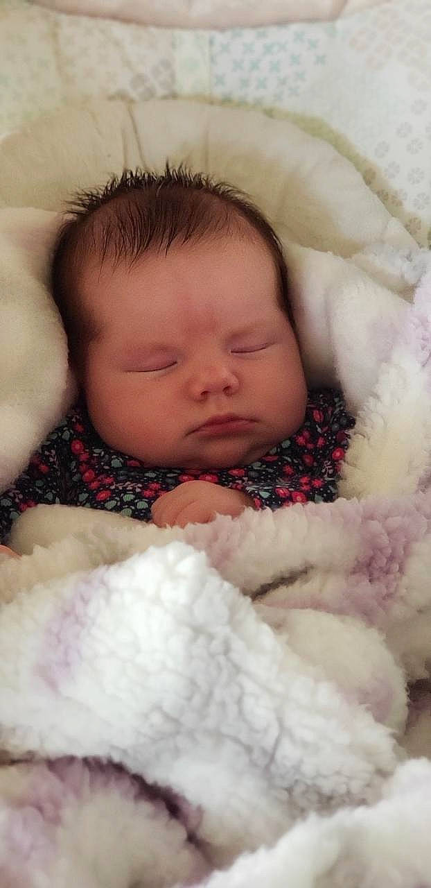 Kaitlynn is registered to the contest to win money with this photo: baby, baby_sleeping, bedtime, blanket, cheek, child, eye, face, fur, head, lip, mouth, nap, nose, person, portrait_photography, skin, sleep, smile, toddler