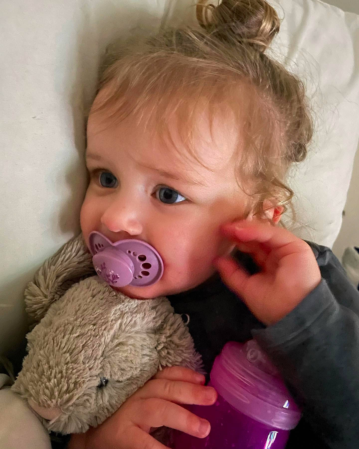 Niamh-rose is registered to the contest to win money with this photo: baby, baby_toddler_clothing, cheek, chin, ear, eye, eyelash, finger, gesture, hand, happy, head, iris, lip, mouth, nose, person, pink, plastic_bottle, skin