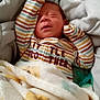 Lyric is registered to the contest to win money with this photo: newborn, baby, sleeping, blanket, striped_clothing, bed, bedding, cozy, infant, pacifier, soft, cute, smiling_bear_pattern, resting, child, indoors, warm, comfort, person, portrait