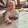 Joséphine participe au concours pour gagner de l'argent avec cette photo : baby, crawling, floor, tile, happy, smiling, indoor, blanket, toy, window, daylight, child, clothing, person, home, curious, play, face, hand, expression