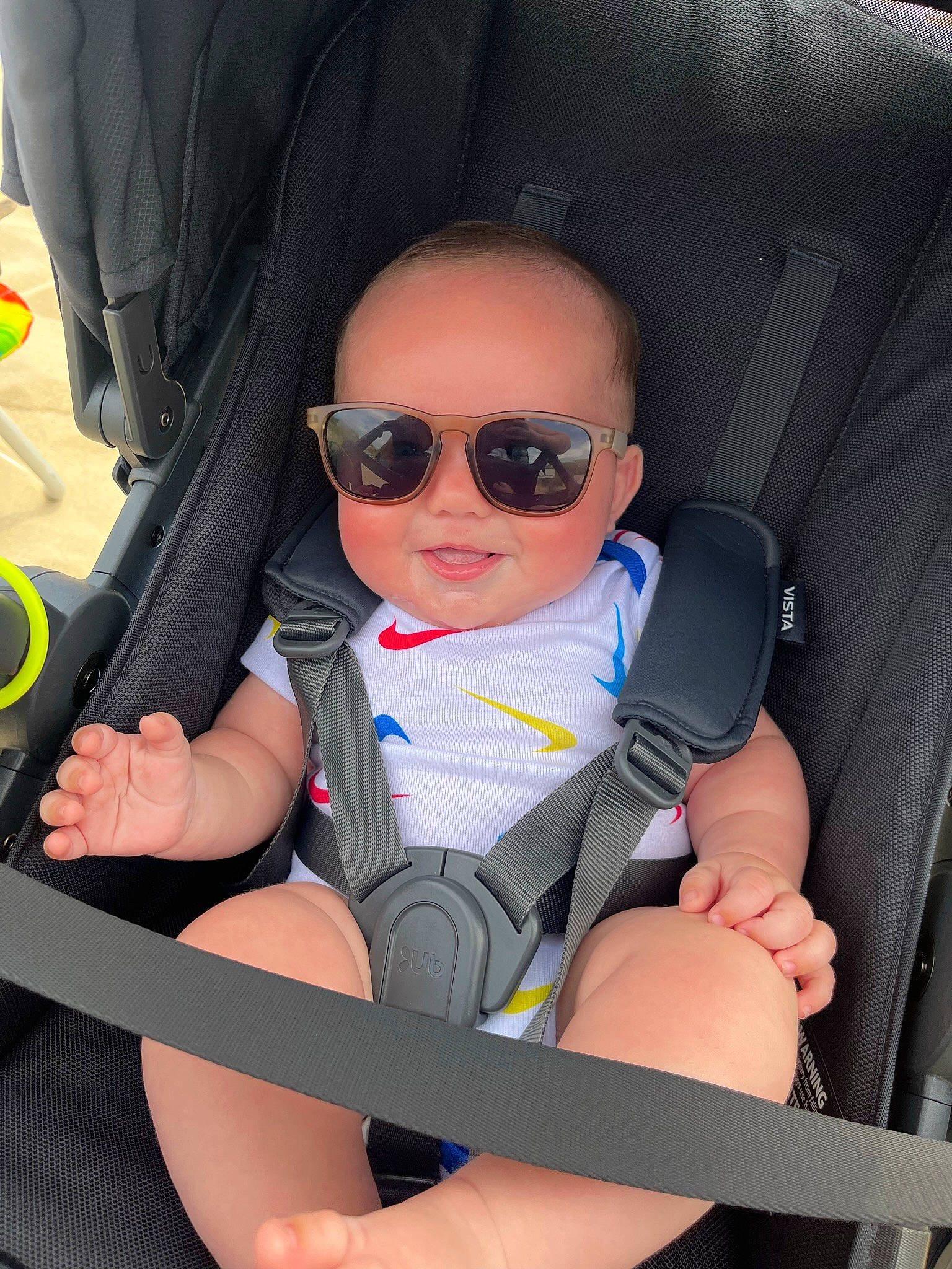 Owen is registered to the contest to win money with this photo: baby_carriage, baby_in_car_seat, car_seat, car_seat_cover, child, comfort, eyewear, finger, gesture, glasses, goggles, head_restraint, leg, motor_vehicle, person, seat_belt, smile, sunglasses, thumb, vehicle_door