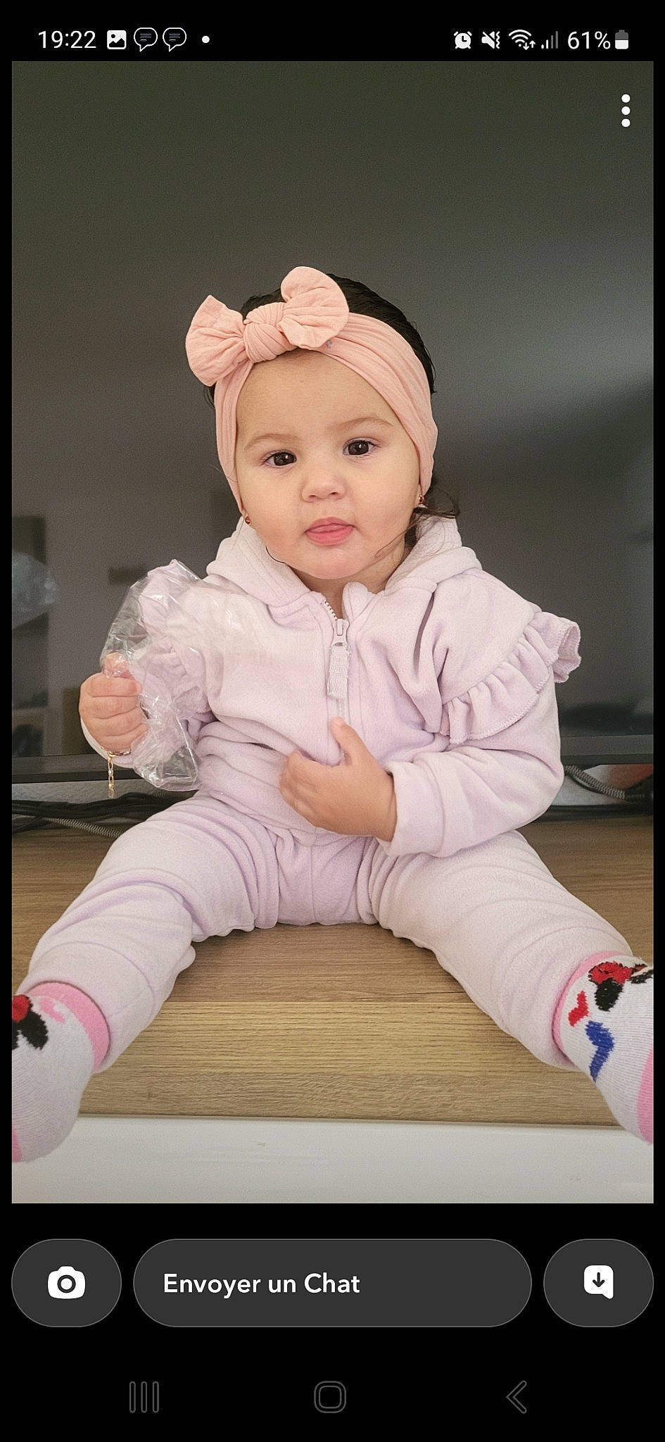 Sublime participe au concours pour gagner de l'argent avec cette photo : baby, baby_toddler_clothing, cap, cheek, child, collar, flash_photography, flooring, fur, happy, headgear, headwear, magenta, peach, person, portrait, portrait_photography, rectangle, sitting, sleeve
