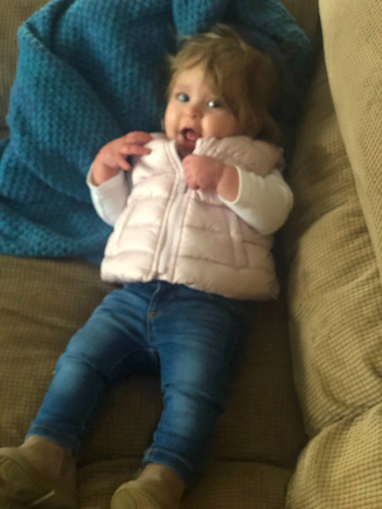 Leena is registered to the contest to win money with this photo: abdomen, baby, cheek, child, comfort, eye, face, finger, fun, jeans, leg, nose, person, sitting, skin, thumb, toddler