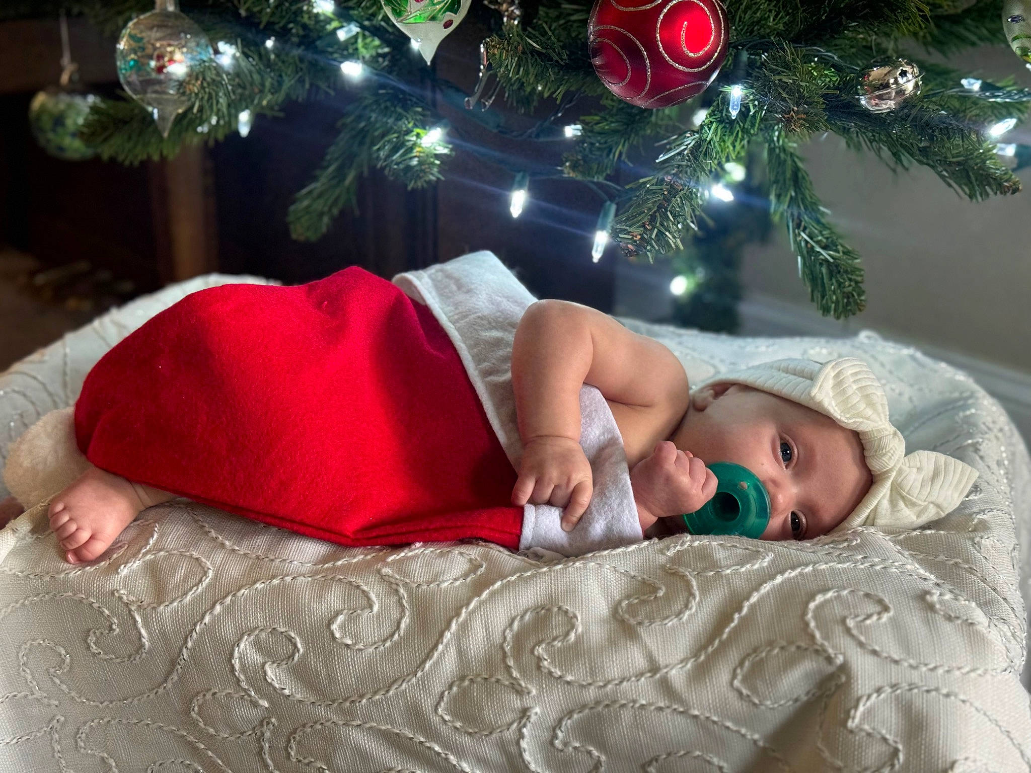 Allison joined the competition — help win amazing prizes! carmine, child, christmas, christmas_decoration, christmas_ornament, christmas_tree, comfort, conifer, event, happy, holiday, holiday_ornament, human_body, human_leg, lap, linens, ornament, person, plant, room