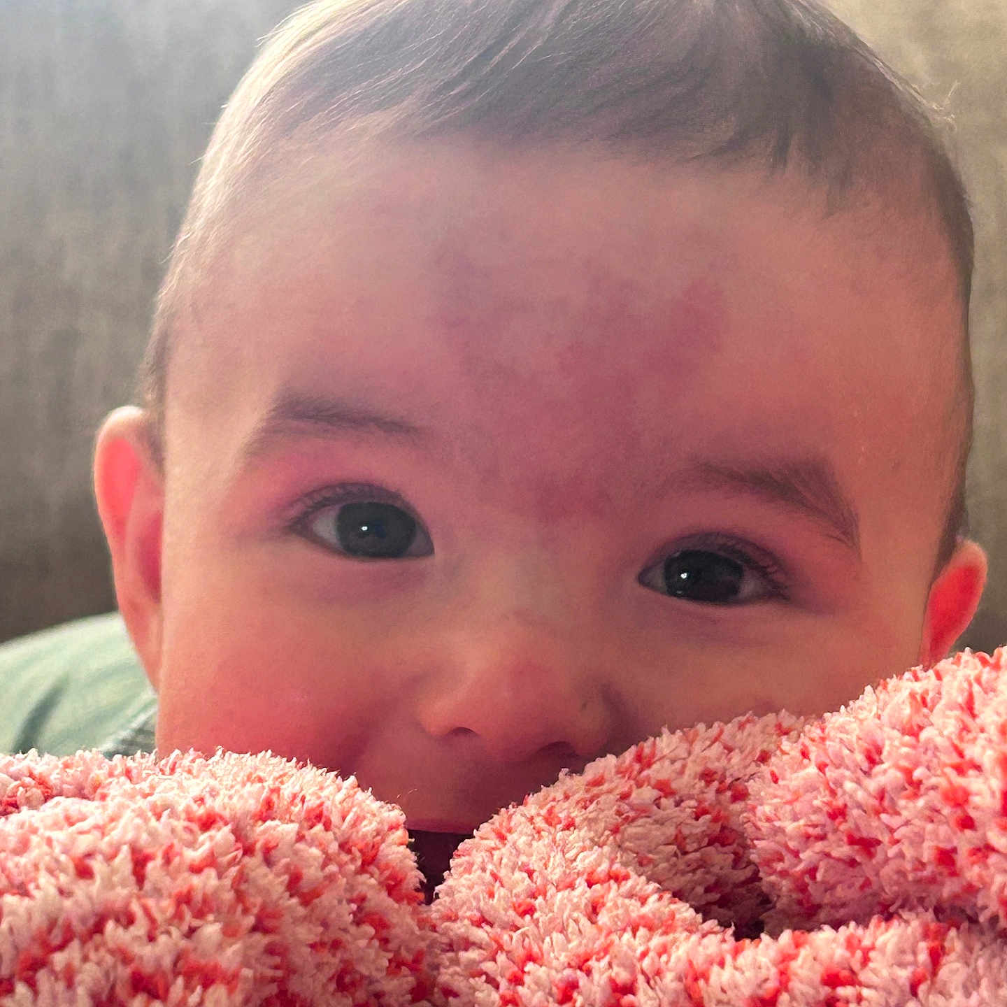 Kaiden is registered to the contest to win money with this photo: baby, face, blanket, pink, red, closeup, infant, cute, child, soft, texture, eyes, portrait, young, cozy, warm, indoor, expression, head, skin