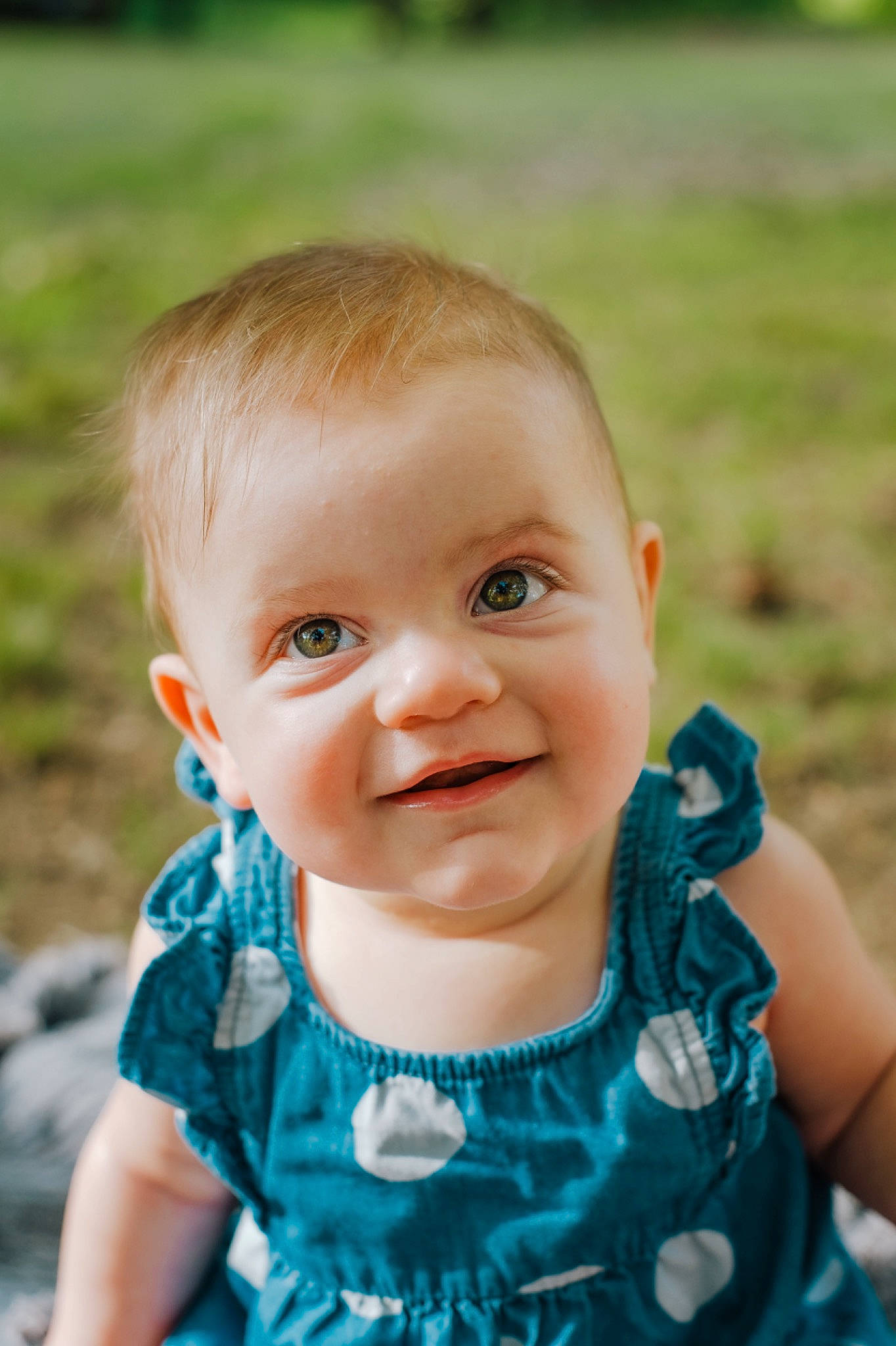 Saylor is registered to the contest to win money with this photo: baby, blue, cheek, child, chin, close_up, eye, face, facial_expression, grass, green, head, joy, lip, nose, people, person, photograph, skin, smile