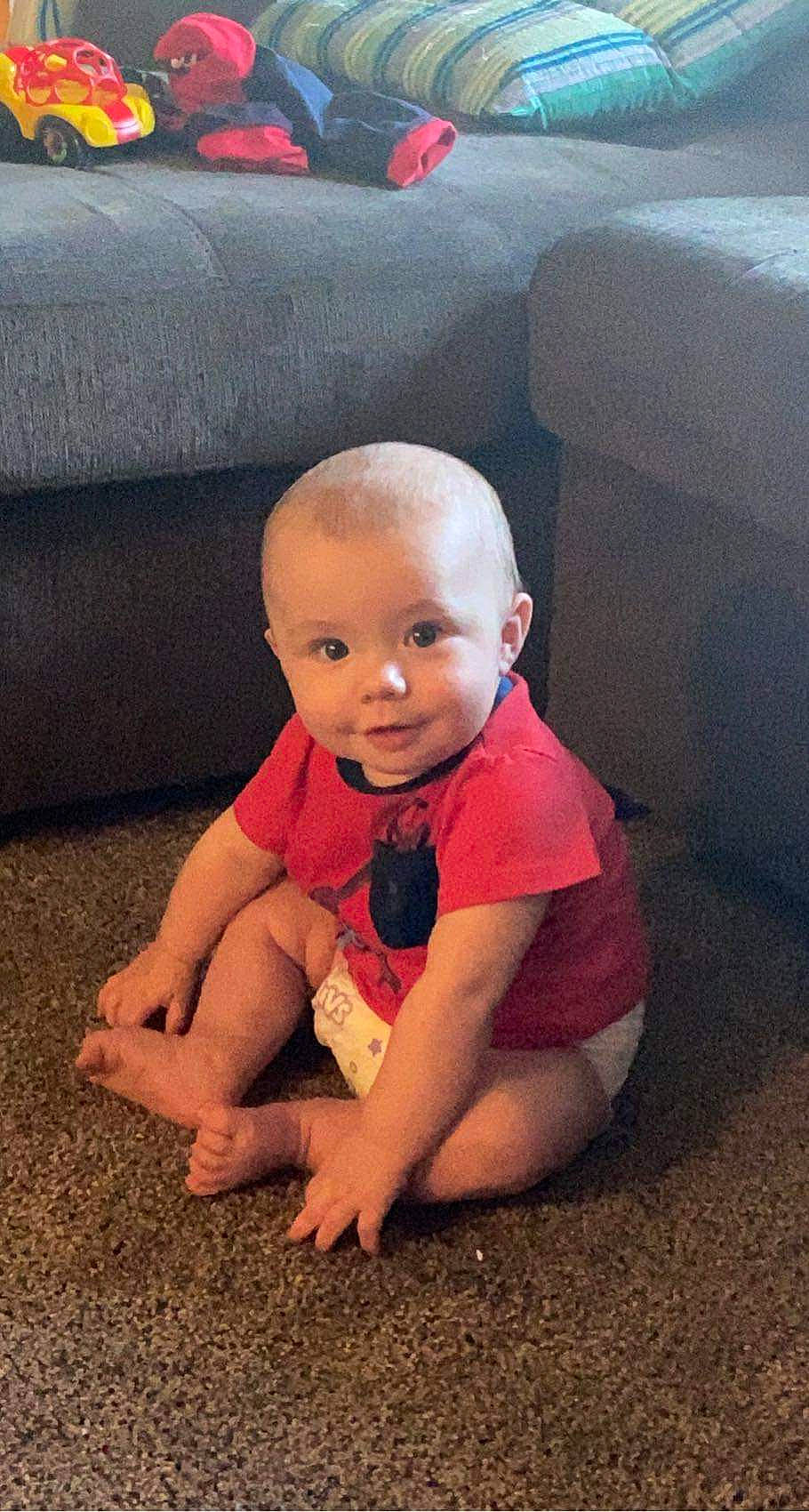 Eivind joined the competition — help win amazing prizes! automotive_tire, baby, baby_toddler_clothing, cheek, comfort, couch, crawling, eye, floor, flooring, grass, head, human_body, human_leg, mouth, person, plant, smile, t_shirt, toddler