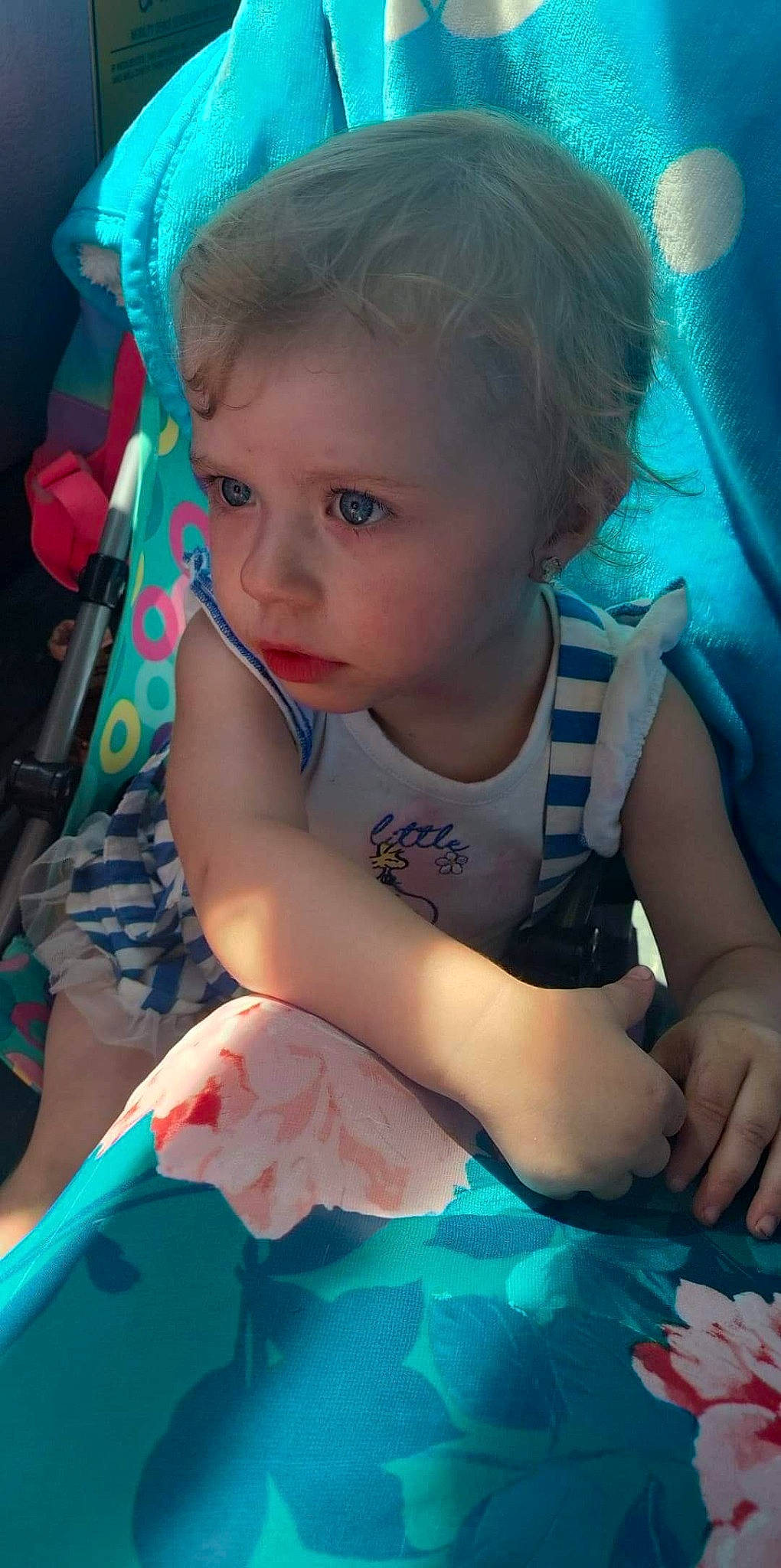 Naila Crowl is registered to the contest to win money with this photo: arm, azure, baby, baby_toddler_clothing, blue, face, facial_expression, finger, green, hairstyle, happy, head, human, mouth, person, photograph, pink, product, skin, textile