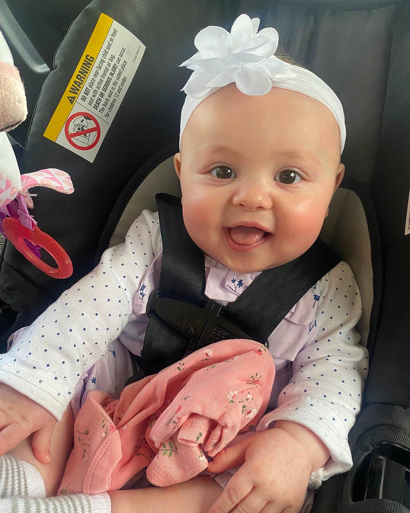 Karsyn is registered to the contest to win money with this photo: baby, baby_products, baby_toddler_clothing, cheek, child, comfort, costume_hat, eye, face, facial_expression, gesture, hand, happy, head, person, pink, skin, sleeve, smile, thumb