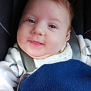 Luana participe au concours pour gagner de l'argent avec cette photo : baby, blanket, blue_eyes, car_interior, car_seat, cheeks, child, close_up, clothing, cozy, drool, face, hand, happy, infant, portrait, seatbelt, skin, smile, tuft_of_hair