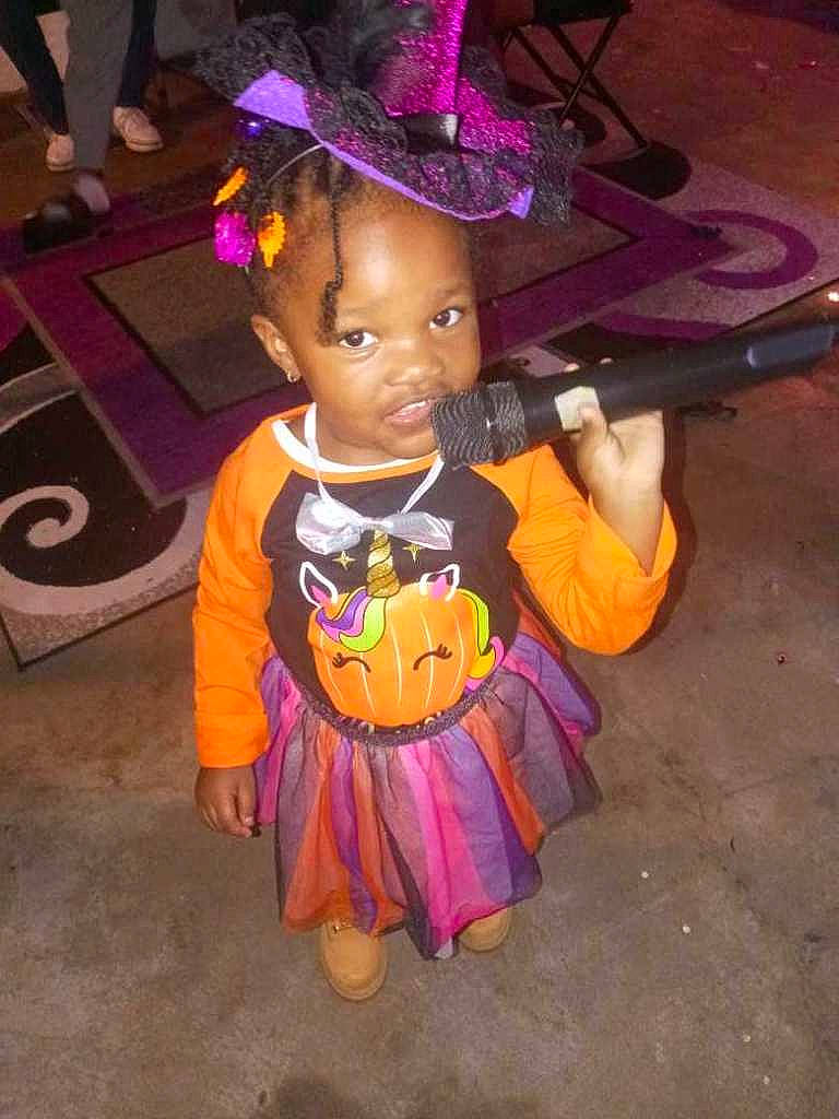 Angenise joined the competition — help win amazing prizes! child, costume, costume_hat, entertainment, event, fashion_accessory, fictional_character, fun, happy, hat, magenta, party_supply, person, pink, purple, sun_hat, toddler, toy, tradition, trick_or_treat