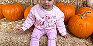 Cataleya is registered to the contest to win money with this photo: child, toddler, pink_clothing, pumpkins, hay_bales, fall, autumn, outdoor, cute, pigtails, shoes, sitting, seasonal, harvest, nature, playful, portrait, young_girl, casual, daylight