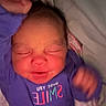 Lakelyn is registered to the contest to win money with this photo: baby, bed, bedding, blanket, child, clothing, cozy, eyes_closed, face, frowning, head, indoors, infant, newborn, photography, portrait, purple_onesie, resting, sleeping, tiny_hand
