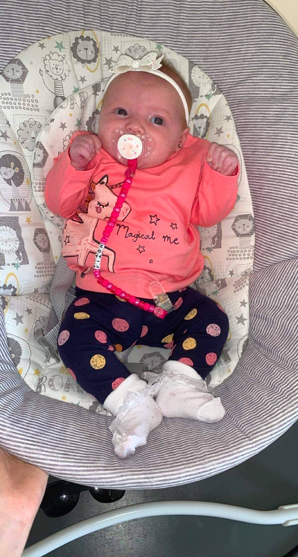 Fiadh joined the competition — help win amazing prizes! baby, baby_products, baby_safety, baby_toddler_clothing, cheek, child, comfort, eye, face, head, human_body, linens, pattern, person, pink, product, sitting, sleeve, textile, toddler