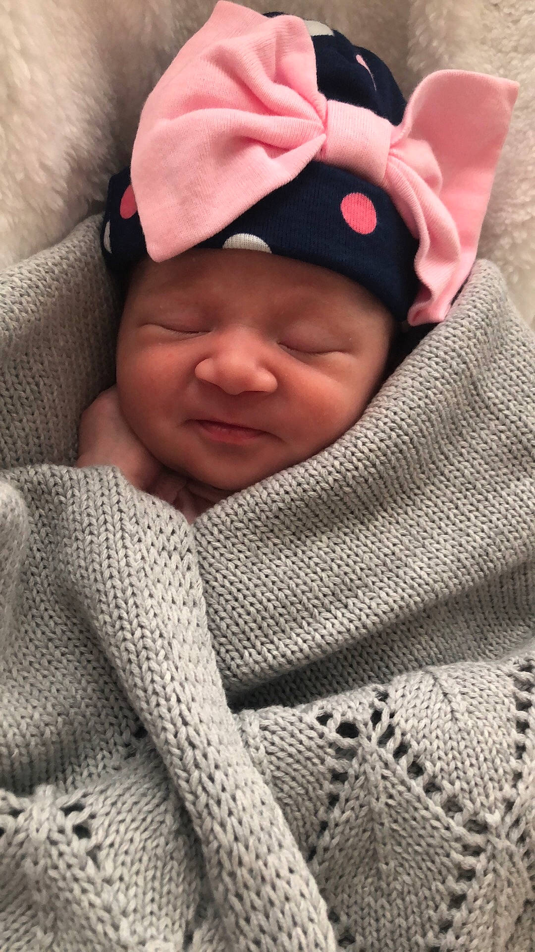 Kensley is registered to the contest to win money with this photo: beanie, cap, child, girl, headgear, headwear, infant, knit_cap, knitting, person, product, skin, smile, textile, wool