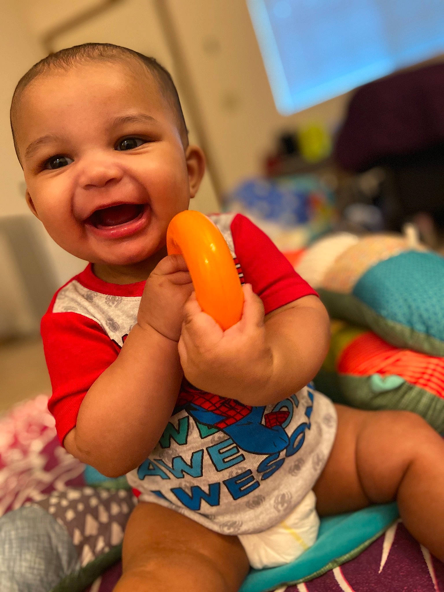 Raiden is registered to the contest to win money with this photo: abdomen, baby, baby_products, cheek, child, face, finger, leg, lip, mouth, nose, person, play, product, sitting, skin, smile, snapshot, toddler, toy