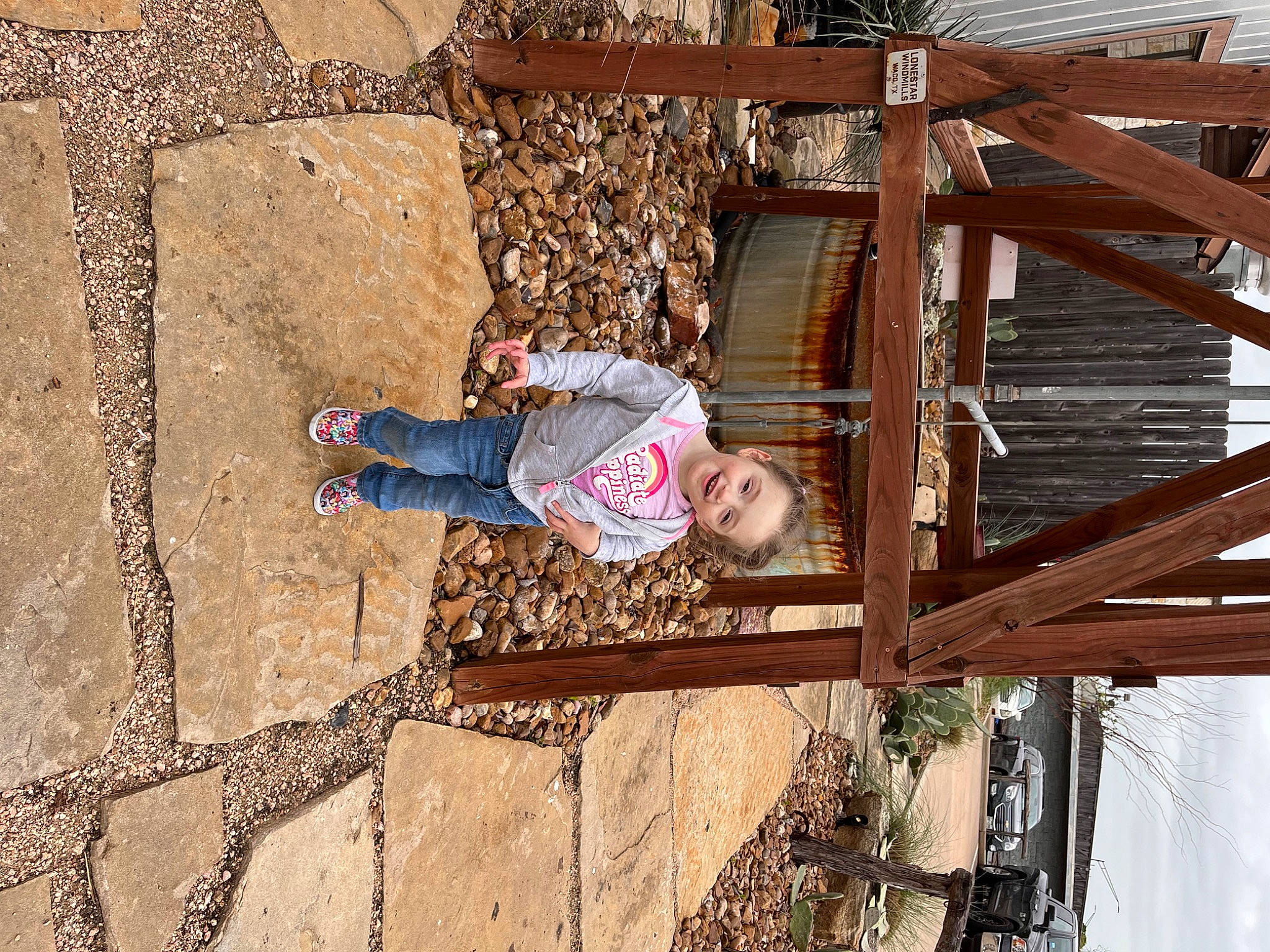Joyce is registered to the contest to win money with this photo: brick, brickwork, child, cobblestone, concrete, flooring, fun, hat, joy, leisure, lumber, pattern, person, road_surface, shadow, sidewalk, smile, soil, sunglasses, toddler