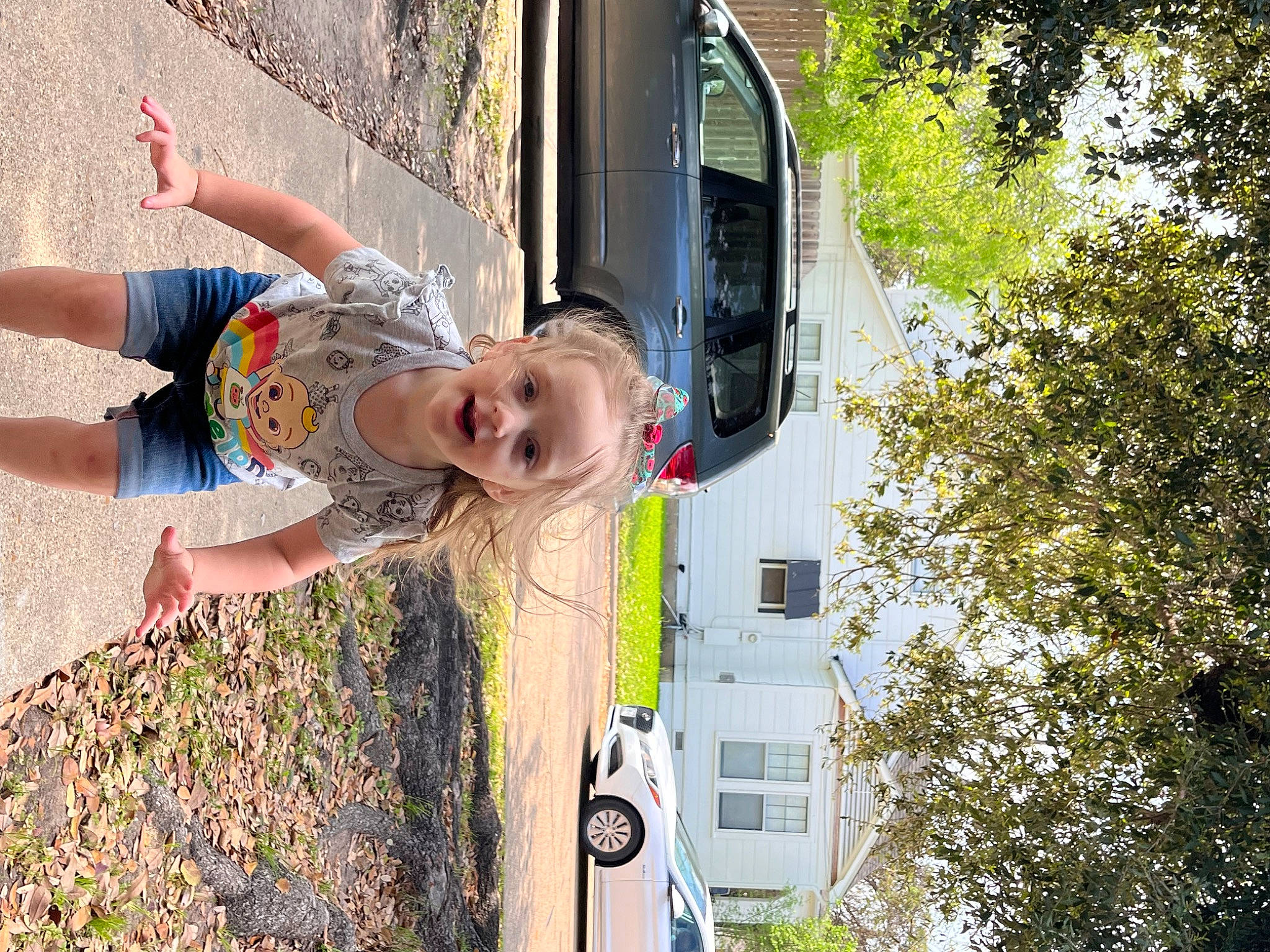 Joyce joined the competition — help win amazing prizes! arm, automotive_exterior, automotive_lighting, automotive_window_part, car, family_car, fun, happy, house, motor_vehicle, person, plant, sky, smile, tire, toddler, tree, vehicle, vehicle_door, window