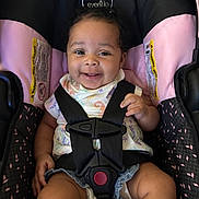 Kaziyah joined the competition — help win amazing prizes! baby, baby_girl, black, car_seat, child, child_seat, clothing, cute, happy, infant, infant_clothing, person, pink, portrait, safety_harness, seat, seatbelt, secure, sitting, smiling