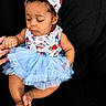 baby, child, tutu, headband, blue, dress, sitting, couch, hand, finger, curious, cute, infant, portrait, clothing, foot, toes, skin, indoors, black_background