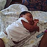 Mei'Leontah is registered to the contest to win money with this photo: baby, sleeping, blanket, diaper, pillow, indoor, child, rest, curled_up, soft_texture, patterned, clothing, furniture, arm, peaceful, infant, cute, relaxation, home, portrait