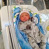 Mei'Leontah joined the competition — help win amazing prizes! newborn, baby, hospital, bassinet, blanket, onesie, hat, sleeping, infant, clothing, bed, cute, child, person, indoors, soft, comfort, rest, maternity, healthcare